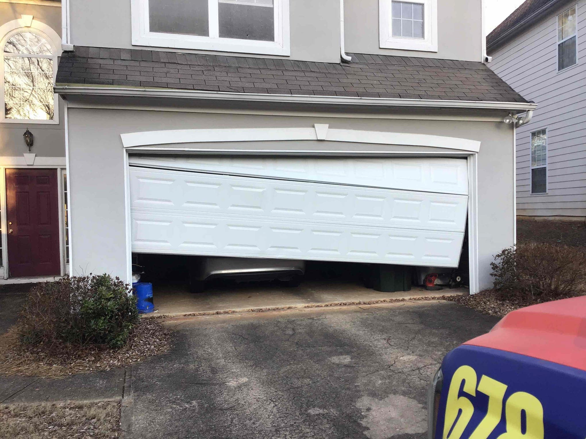 Garage door off-track repair