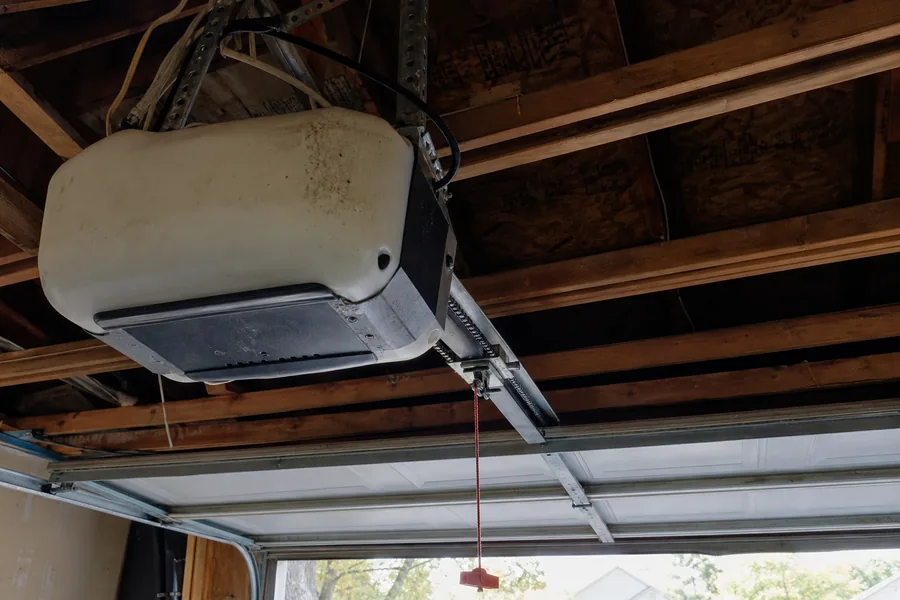 A garage door opener motor and rail in a New York, NY garage