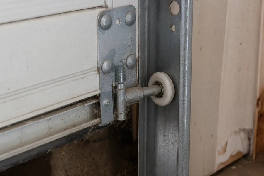 A garage door roller in its track in New York, NY