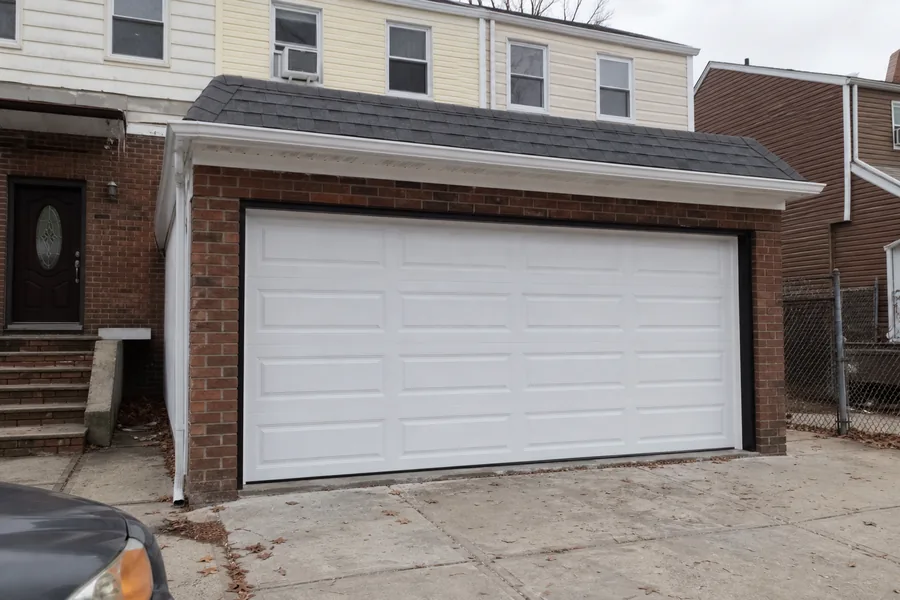 A new sectional garage door installed by OnPoint Pro Doors in New York, NY
